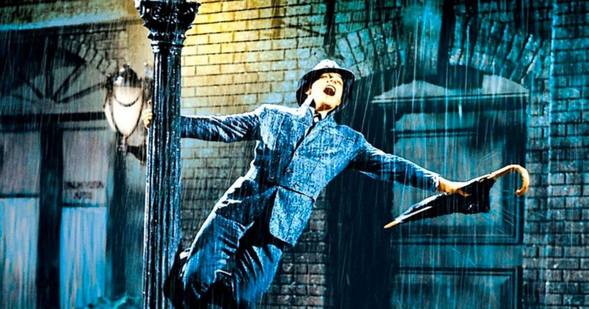 La estrella de Singin in the Rain, Gene Kelly, se balancea en una farola bajo la lluvia