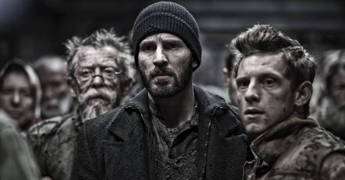 John Hurt, Chris Evans y Jamie Bell, en el personaje, están juntos durante una escena interior de