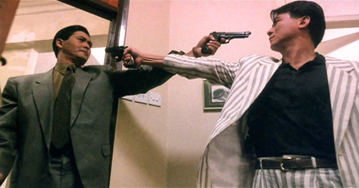 Dos personajes de The Killer apuntándose con pistolas a la cabeza.